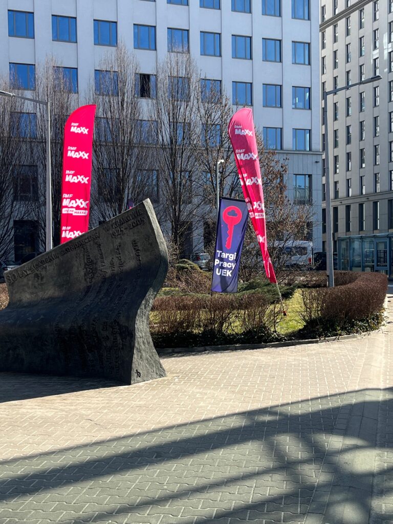 Job fair flags on the KUE campus.