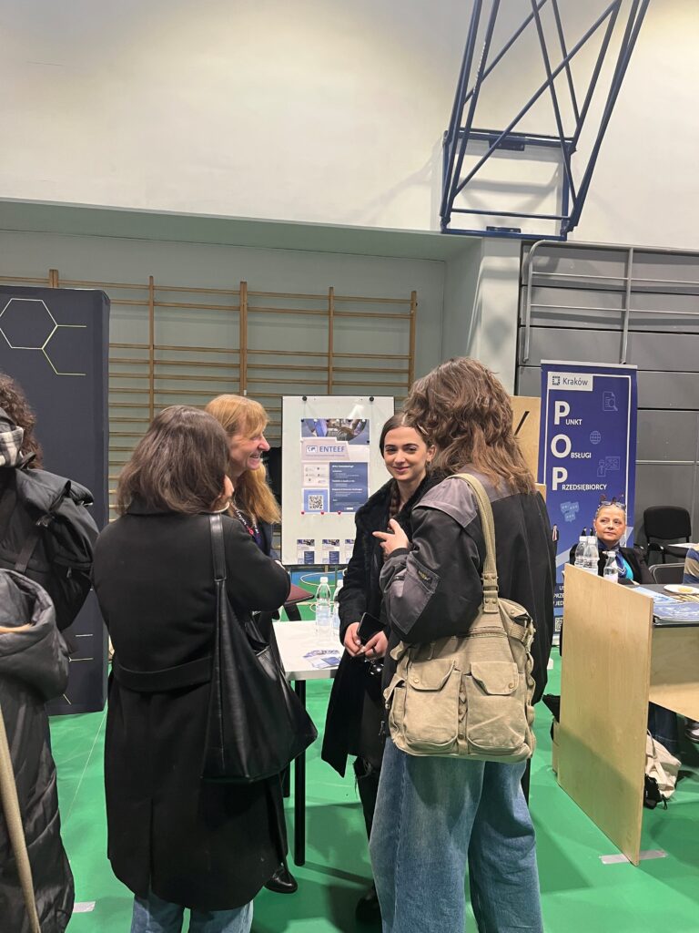 Students next to the ENTEEF project stall.