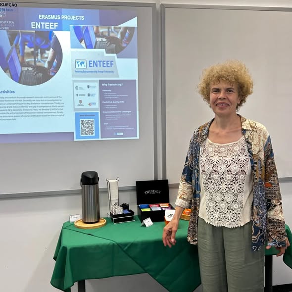 Prof. Dana simian in front of the screen with ENTEEF project poster.